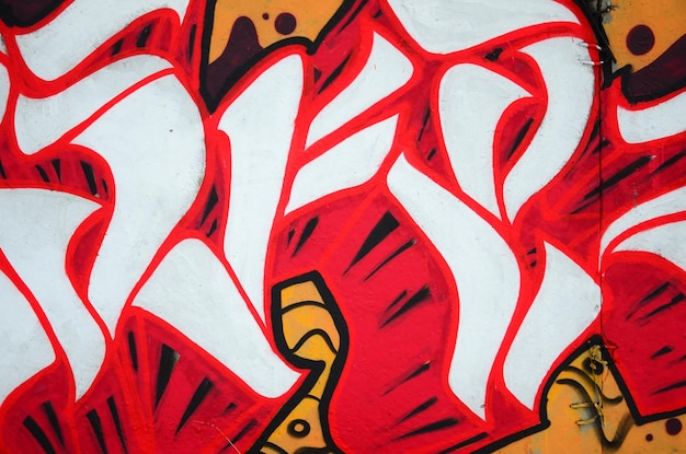 Photo fragment de peintures de graffitis de rue colorées avec contours et ombrages de près