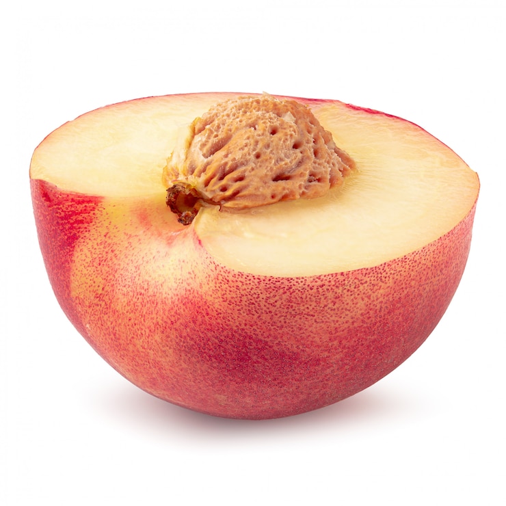 Photo fruits moitié et tranche nectarine isolé sur fond blanc.
