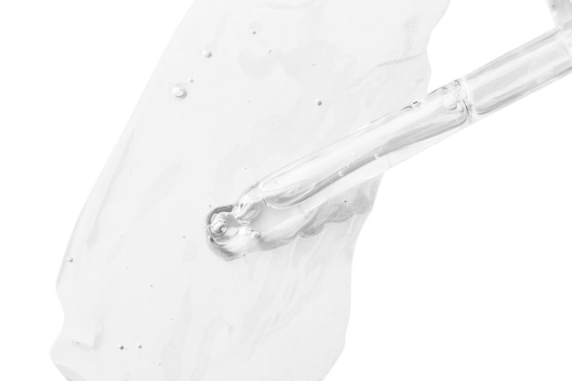 Fuite de gel transparent du compte-gouttes dans un contour clair Bulles du gel Texture gel Isolé sur fond blanc