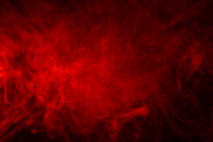 Photo fume rouge sur fond noir
