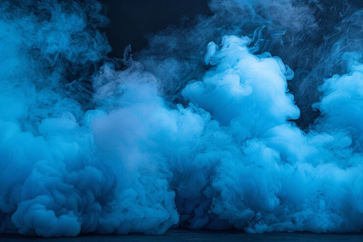 Photo la fumée bleue réaliste s'étend sur un fond noir