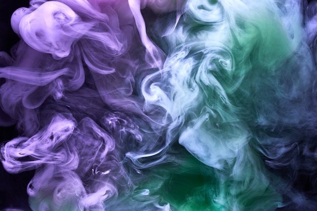 Fumée lumineuse multicolore abstrait brouillard coloré couleurs vibrantes papier peint tourbillon mélange peinture sous l'eau