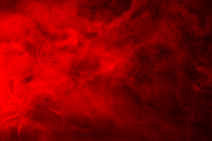 Photo fumée rouge sur fond noir, fond abstrait