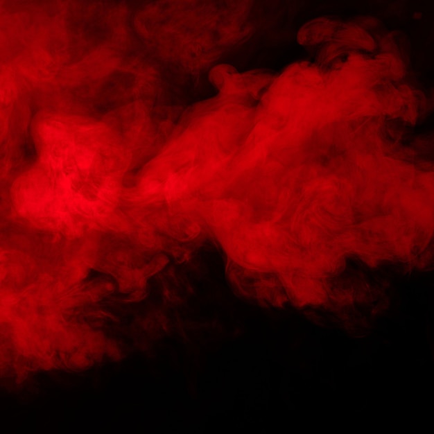 Photo fumée rouge sur fond noir