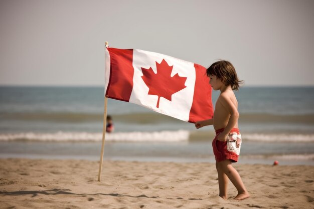 Un garçon tenant un drapeau canadien sur la plage