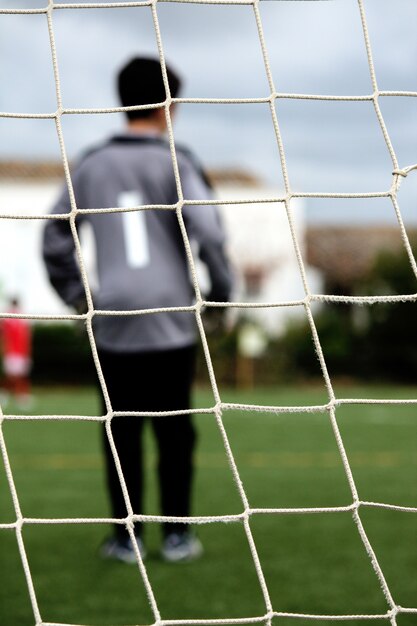 Photo gardien de but sur le terrain de football