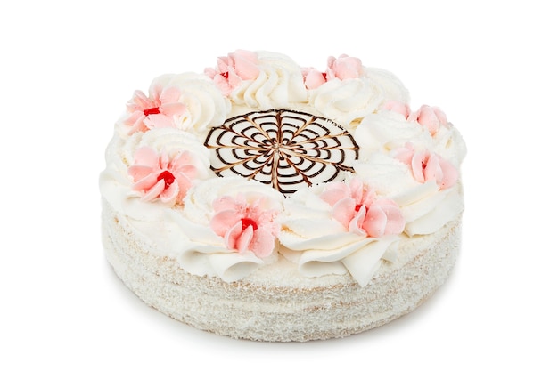 Gâteau au chocolat blanc décoré de fleurs crème isolé