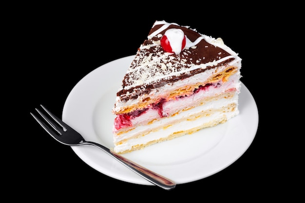 Gâteau de fantaisie avec cerise sur le dessus