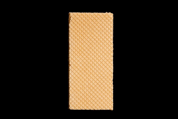 Photo gaufre rectangulaire isolée sur fond noir. photo de haute qualité