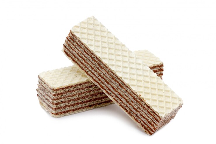 Photo gaufrettes croquantes au chocolat et aux noix sur un fond blanc