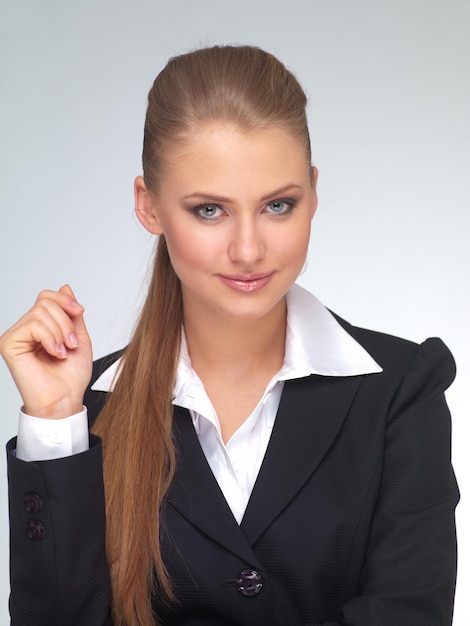 Photo gestionnaire de jeune femme en costume sur un fond clair