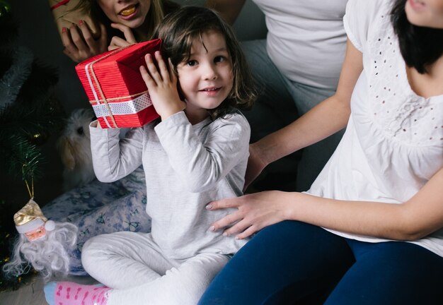 &quot;Girl with family holding gift&quot;