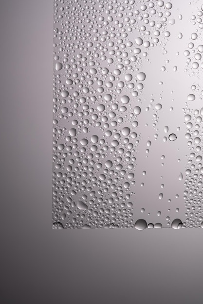 Photo des gouttes d'eau sur un fond gris transparent