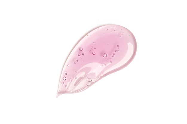 Photo les gouttes de tache de gel cosmétique liquide isolent la texture sur un fond blanc.