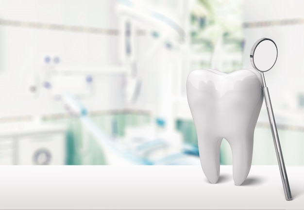 Grande dent et miroir de dentiste dans la clinique de dentiste sur l'arrière-plan
