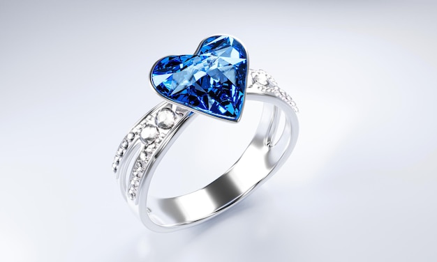 La grande forme de cœur en diamant bleu est entourée de nombreux diamants sur l'anneau en or platine placé sur un fond gris Anneau de mariage en diamant élégant pour femmes rendu 3D