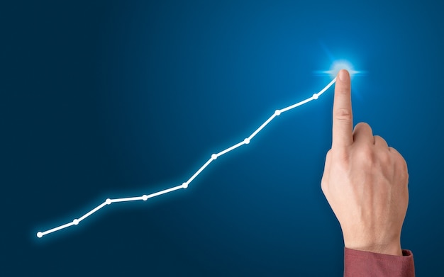 Graphique de dessin à la main, stock graphique de croissance. Développement et croissance de l'entreprise. homme, main, pointage, ligne, point, graphique, plan de croissance, futur, entreprise
