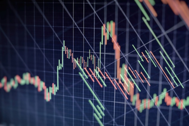 Graphique économique avec des diagrammes sur le marché boursier, pour les concepts et les rapports commerciaux et financiers. Fond bleu abstrait.