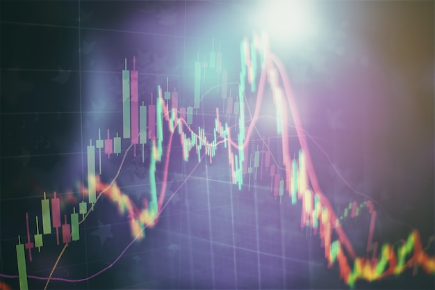 Graphique économique avec des diagrammes sur le marché boursier, pour les concepts et les rapports commerciaux et financiers. Fond bleu abstrait.