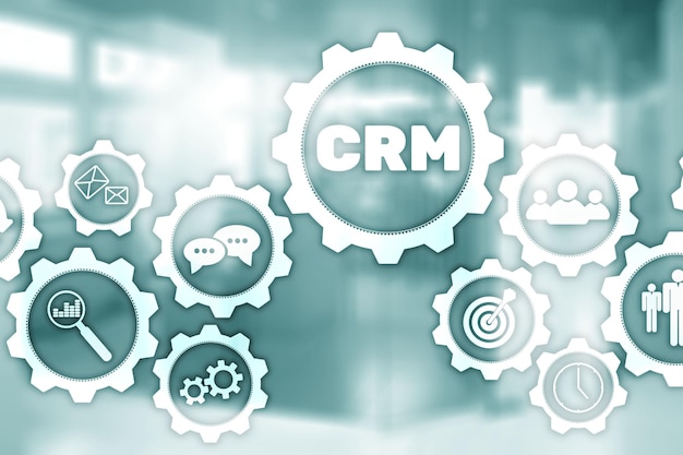 Graphiques de concept de service d'analyse de gestion client CRM sur fond de bureau flou