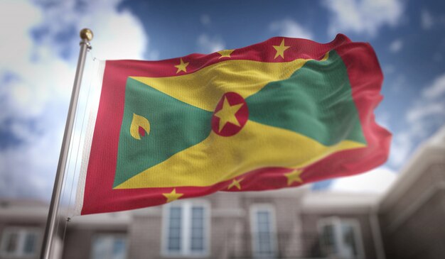 Grenada Flag Rendement 3D sur Blue Sky Building Background