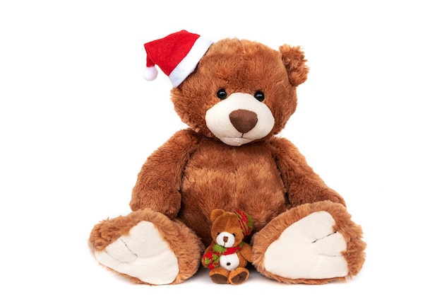 Gros ours en peluche et petit ours en chapeaux de Noël