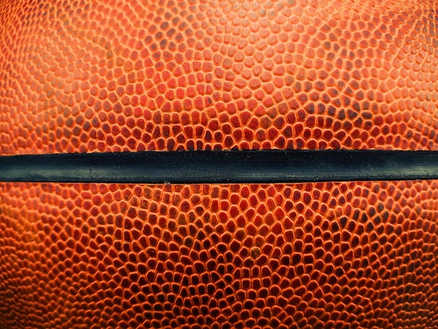 Gros plan détail de la texture du ballon de basket
