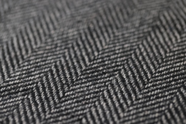 Gros plan du concept de fond de tissu de texture de tissu à chevrons noir et blanc