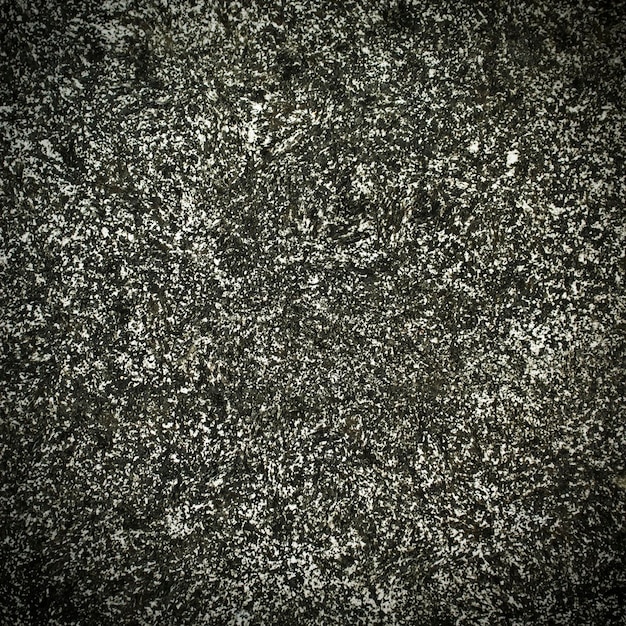 Gros plan du fond de texture de granit gris.