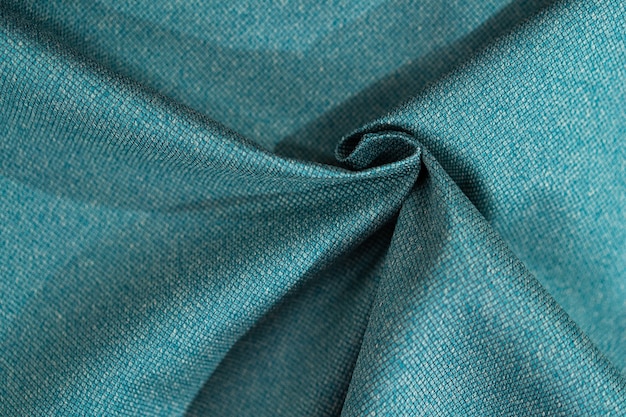 Gros plan de l'échantillon de tissu turquoise de luxe