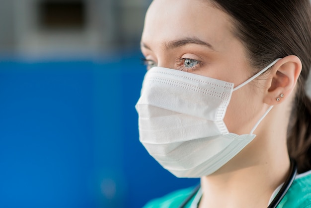 Photo gros plan, femme, infirmière, porter, masque