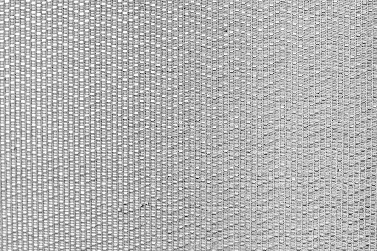 Photo un gros plan d'un fond gris avec un motif de points et un diamant
