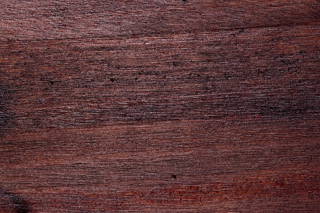 Gros plan de fond de plancher en bois rouge et noir