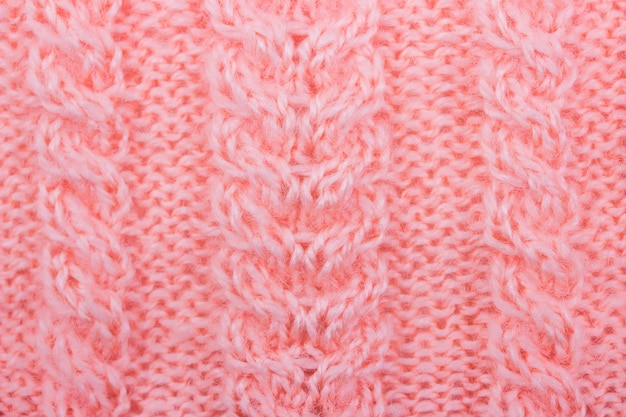 Gros plan de fond de texture de laine tricotée rose à la main