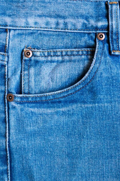 Gros plan de fond de texture de poche jeans denim bleu