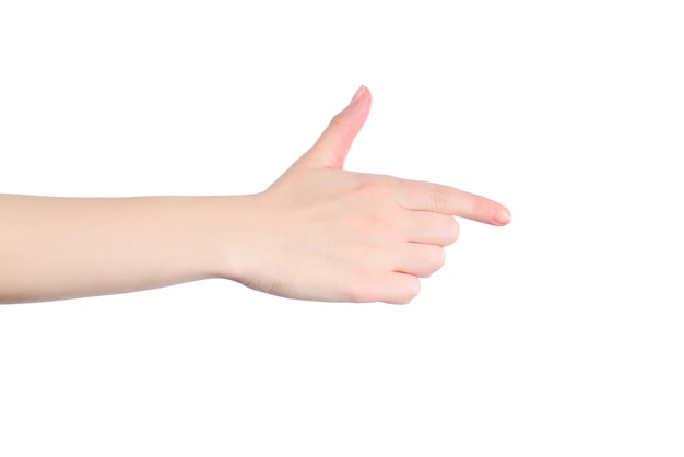 Gros plan d'une main féminine avec une peau pâle pointant ou touchant isolé sur fond blanc Isolé
