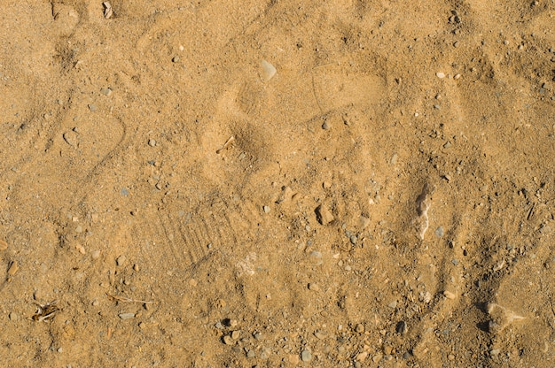 Gros plan d&#39;un motif de sable sur une plage en été