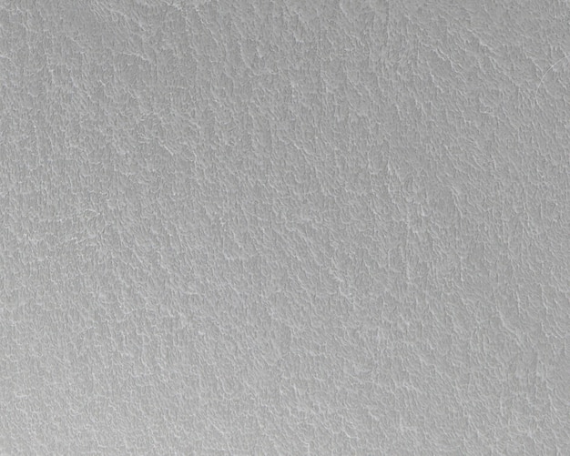 Un gros plan d'un mur texturé gris