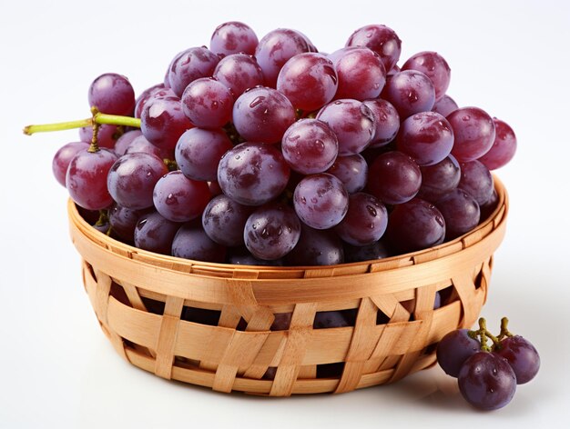 Un gros plan d'un panier de raisins sur une surface blanche ai générative