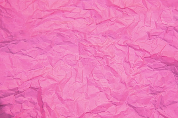Gros plan de la ride rose froissé vieux avec la texture de la page papier fond rugueux.