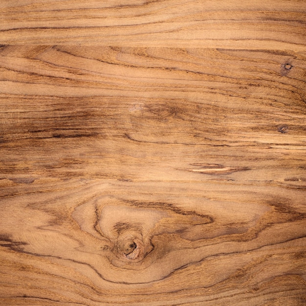 Un gros plan d'une table en bois avec une texture rugueuse