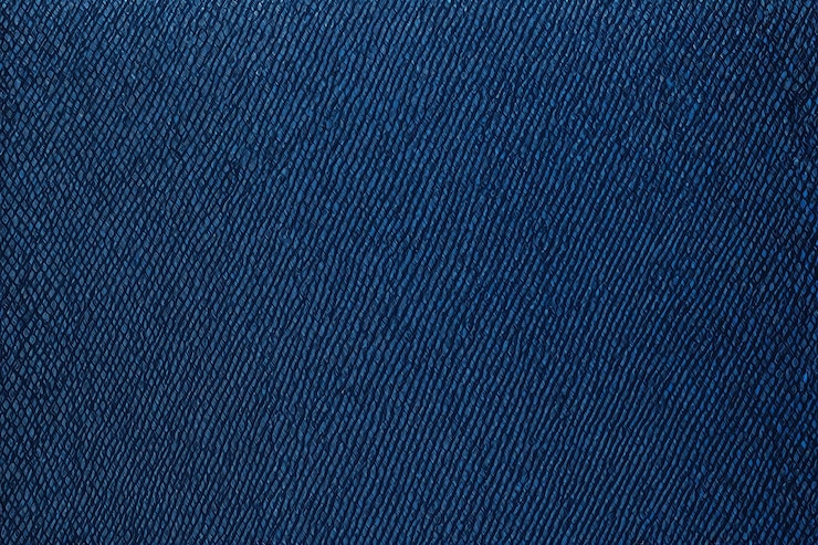 Photo un gros plan d'une texture de cuir bleu avec une petite couture