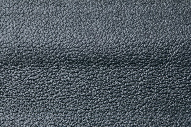 Gros plan de texture de cuir gris foncé utile comme arrière-plan