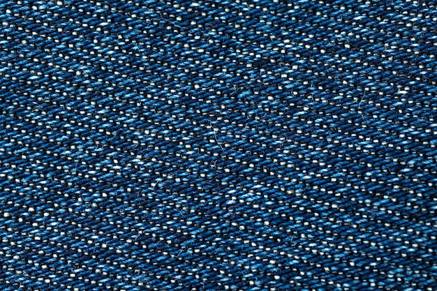 Gros plan de texture denim bleu, arrière-plan textile détaillé à haute résolution