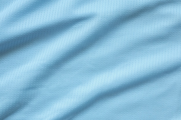 Gros plan sur la texture du maillot de football bleu