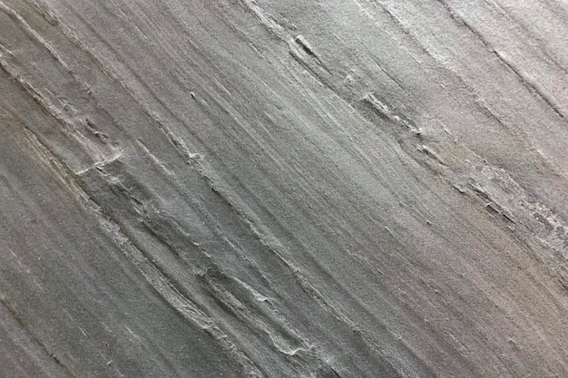 Photo gros plan de la texture du mur de ciment vieux gris patiné