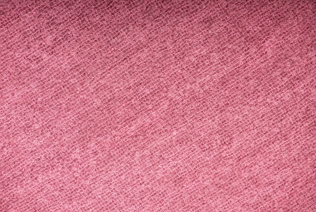 Gros plan de la texture de tissu tricoté rose transparente