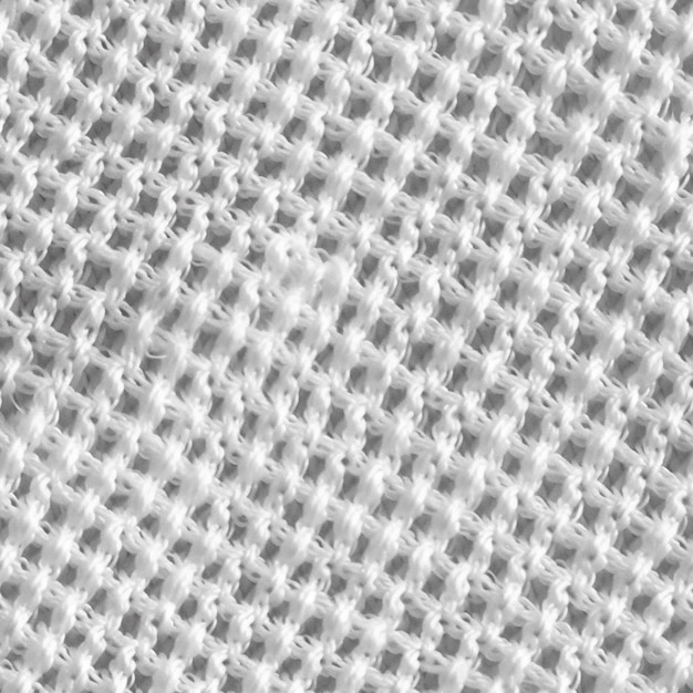 Photo un gros plan d'un tricot blanc avec un motif de petits trous.