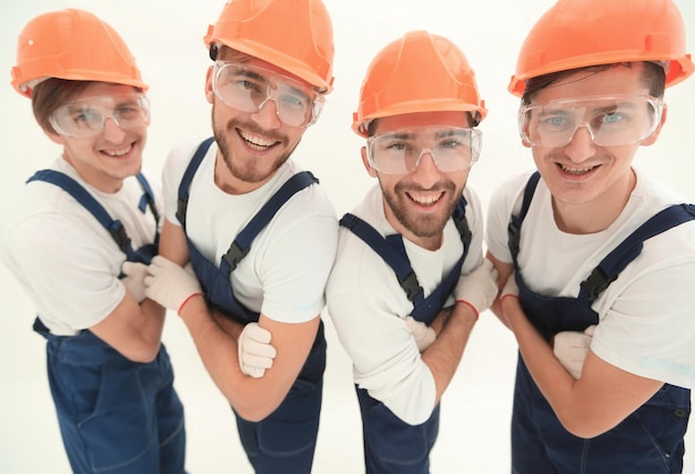 Gros planUn groupe de travailleurs industriels professionnels isolés sur blanc