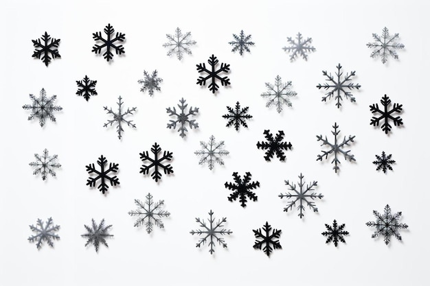 Photo un groupe de flocons de neige sur une surface blanche